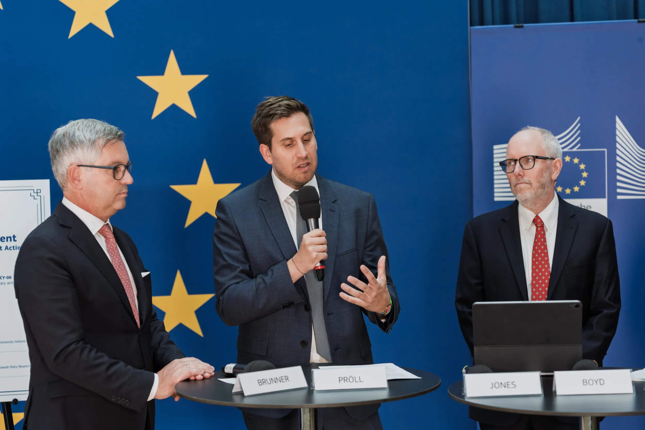 European Union Event Photographer | Grant Signing Ceremony in Vienna Fedor Vasilev Photographer In Berlin European official giving a speech in a contemporary conference space