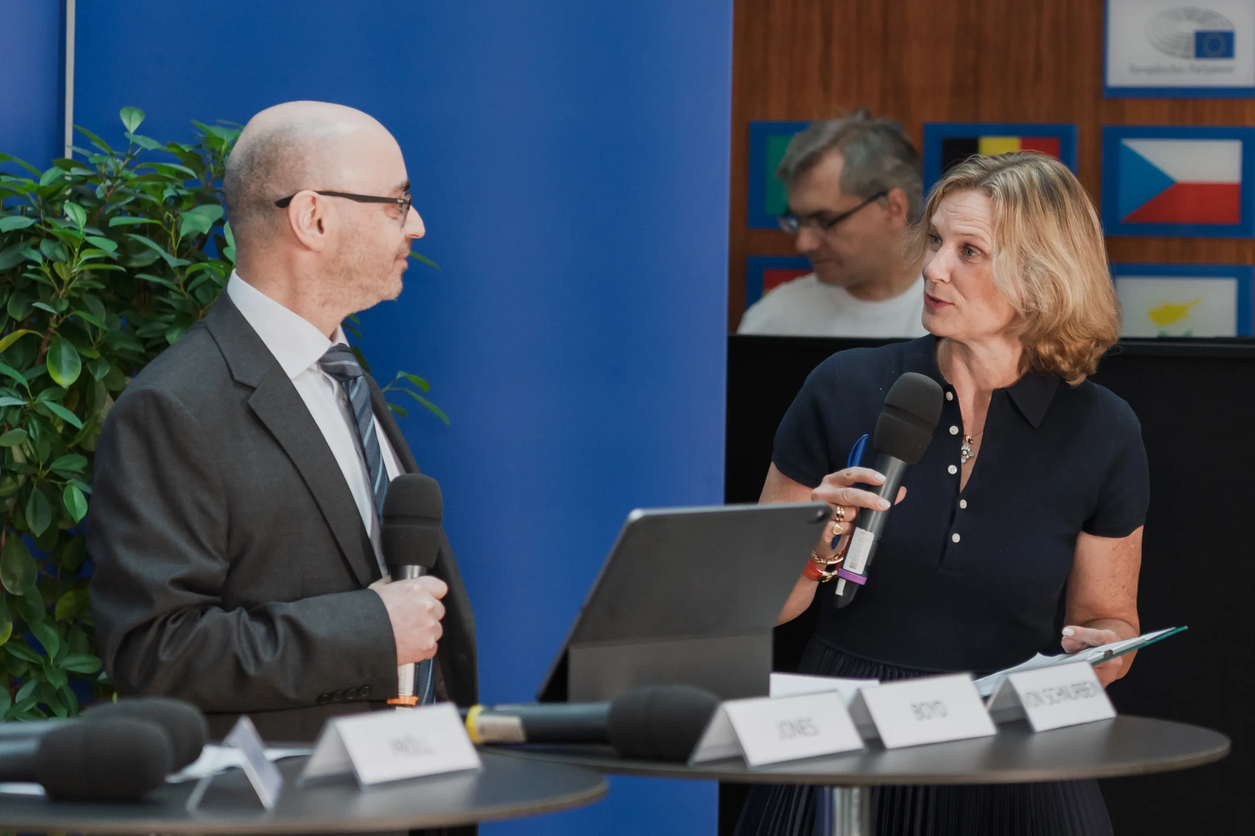European Union Event Photographer | Grant Signing Ceremony in Vienna Fedor Vasilev Photographer In Berlin An event moderator asks an EU official a follow up question during a grant signing ceremony