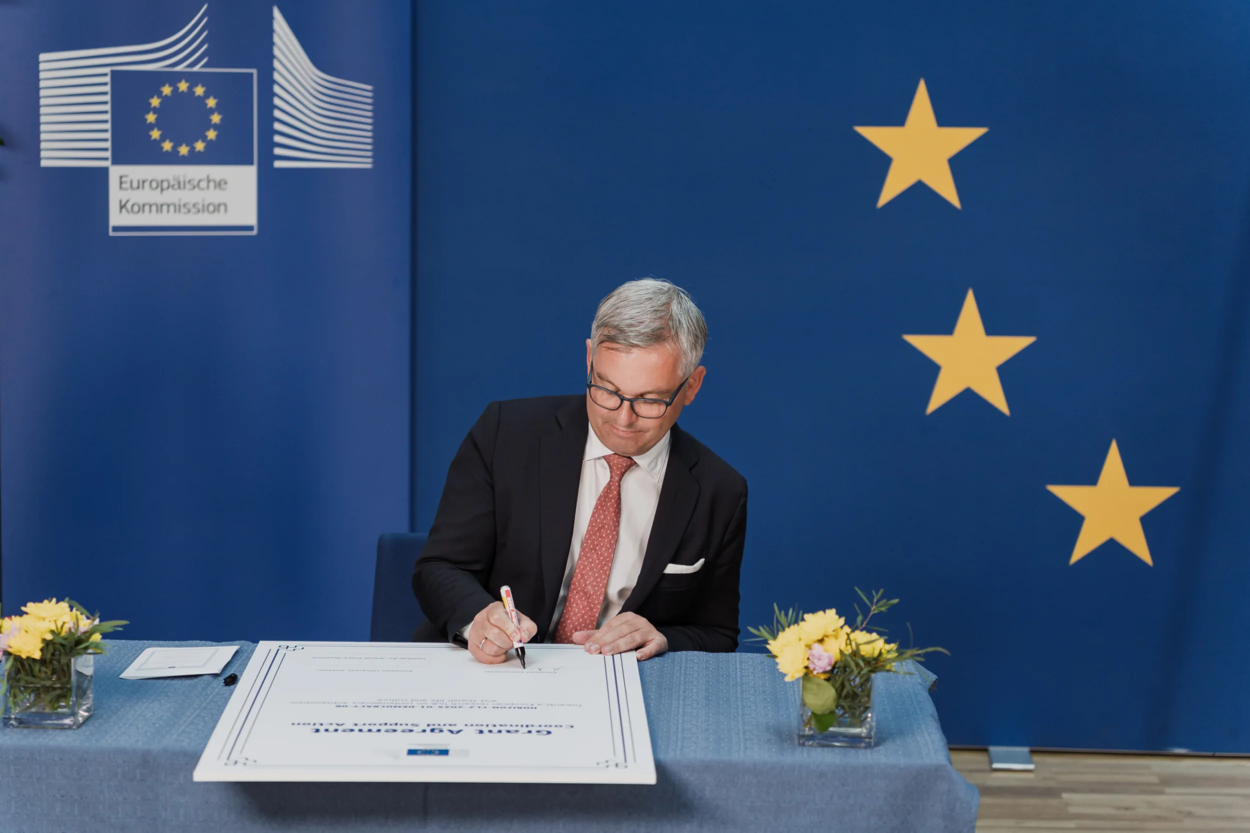 European Union Event Photographer | Grant Signing Ceremony in Vienna Fedor Vasilev Photographer In Berlin Grant signing ceremony photography showing European officials during official document signing