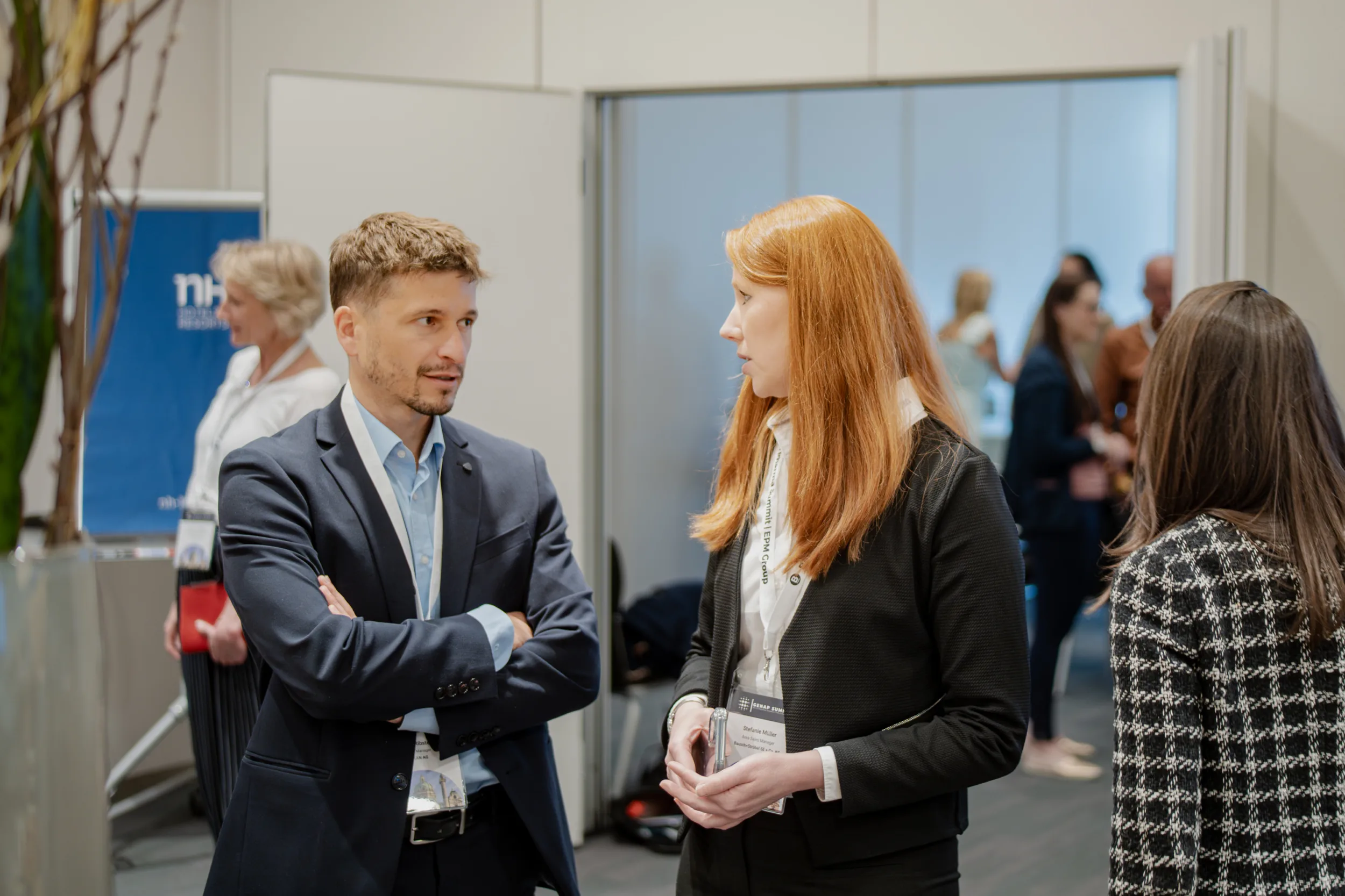 Genup Summit | Medical Conference Photography and Product Expo Fedor Vasilev Photographer In Berlin Professionals in business attire having a conversation at a Genup Summit networking event